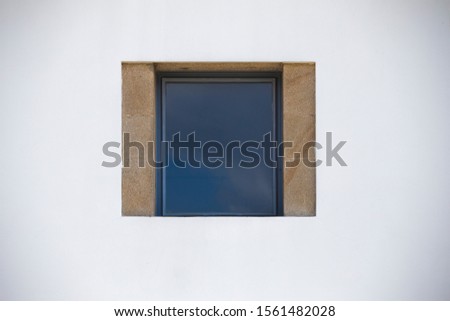 Closed white window isolated on a white wall