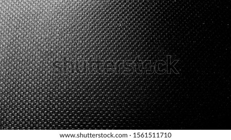 Abstract Black dot wall texture. Use as a background or wallpaper. Space for text. Black and white, so contrast and grainy