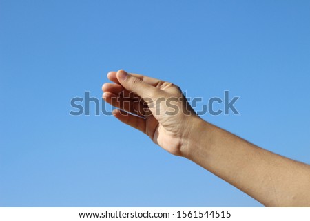 Woman hand isolated on clear sky background