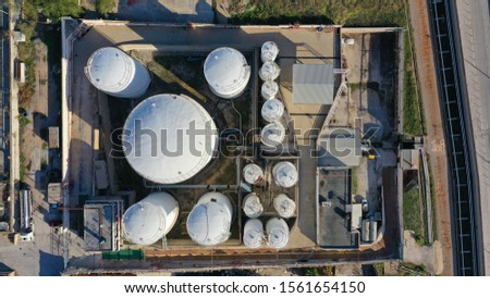 Aerial top down photo of industrial plant with huge petrochemical tanks