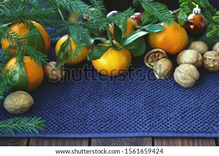 Christmas composition with nuts and tangerines
