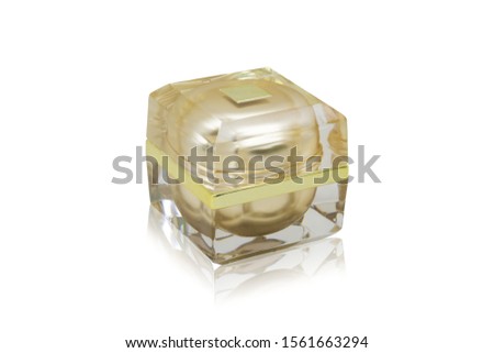 Golden cream jar on a white background Clipping path