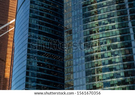 Modern glass business center in Moscow city. Modern urban architecture, view of the windows of an office building.