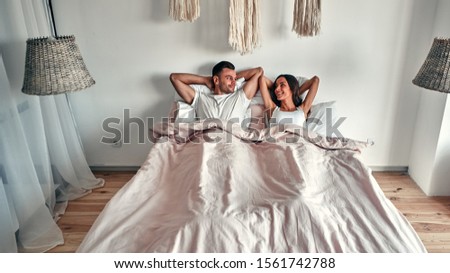 Lovely Couple In Bed Lying In Bedroom Images And Stock