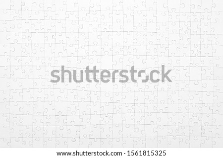 White jigsaw puzzle. Horizontal on white background copy space for your text.