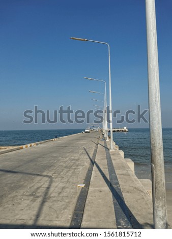 Photos of beautiful bridges and electricity poles by the sea.