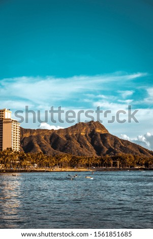 Diamond Head crater in Oahu, Hawaii. View from boat in ocean at sunset 