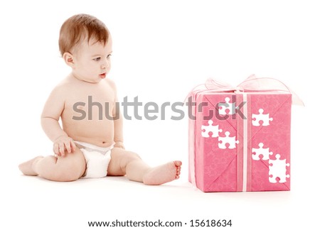 picture of baby boy in diaper with big puzzle gift box