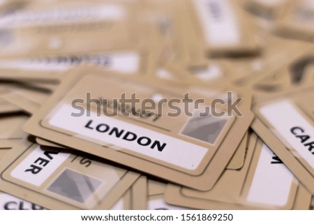 London word on a yellow card, shallow depth of field. Multiple cards visible out of focus.Capital of England, United Kingdom, concept of travel,brexit