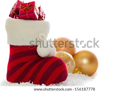 christmas stocking with decorations isolated on white