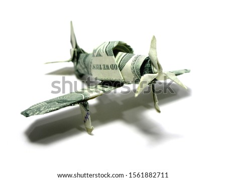 Origami money airplane FIGHTER war  military aircraft one dollar green expensive Isolated on White Background 