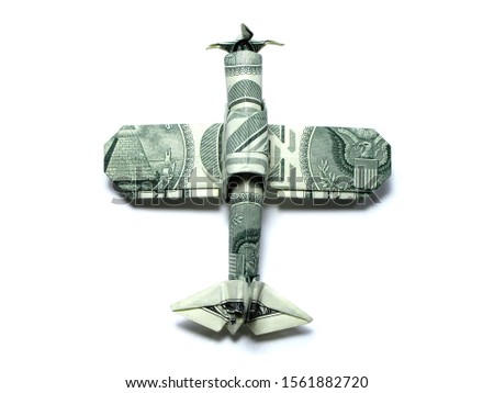 Origami money airplane FIGHTER war  military aircraft one dollar green expensive Isolated on White Background 