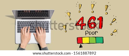 Poor credit score theme with person using a laptop computer
