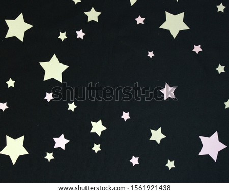 Pink and Gold Stars on a Black Background with small space for text, Social Media Marketing Royalty-Free Stock Photo #1561921438