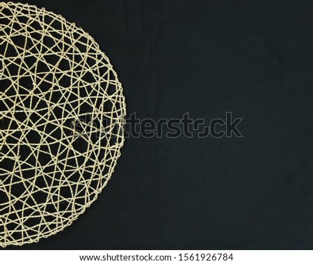 Woven circle on black background photo, Social Media Marketing text space Royalty-Free Stock Photo #1561926784