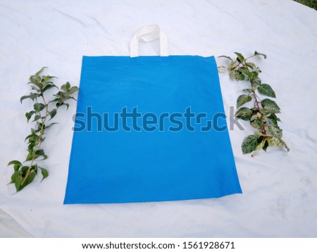 blue color Non Woven ECO Friendly handle loop Bag with Green Plant Leaves