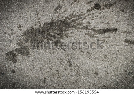 Black splash on asphalt