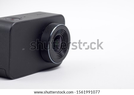 Black action camera on an isolated background
