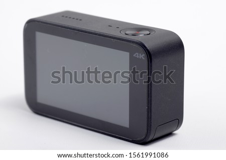 Black action camera on an isolated background