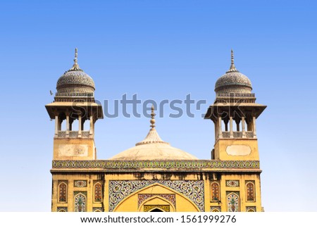 Dome and minaret of the mosque with blue sky 