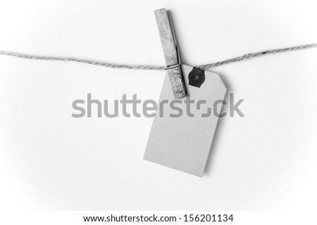Close up of a note and a clothes peg on white background with clipping path