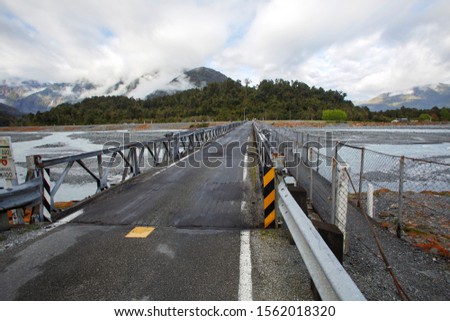 The Waiho River Bridge is located south of Franz Josef township on the Fox Glacier Highway. It was washed away during a storm in March 2019. A Bailey bridge is a type of pre-fabricated truss bridge.