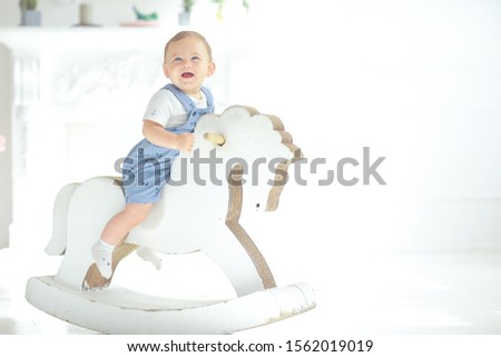 child rocking horse / little boy riding a toy horse, rocking chair children's toy vintage