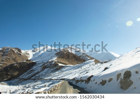 View landscape with Himalayas mountains range between Khardung La road pass go to Nubra Valley in Hunder city while winter season at Leh Ladakh in Jammu and Kashmir, India Royalty-Free Stock Photo #1562030434
