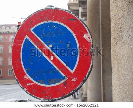 red and blue no parking traffic sign
