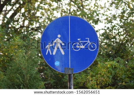 Sign for cycle path. Urban blue round symbol for bicycle way. Segregated informative pedal cycle and pedestrian route sign for safety transport.
