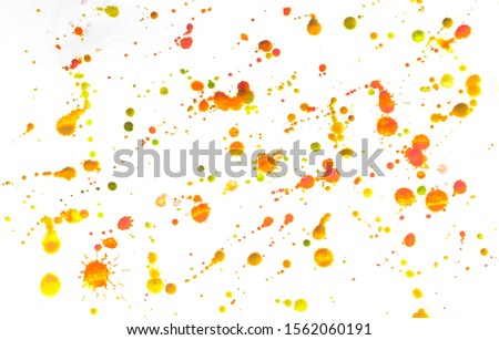 Multi-colored splashes of watercolor paints on white paper. Abstract summer background