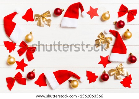 Top view of Christmas decorations and toys on wooden background. Copy space. Empty place for your design. New Year concept.