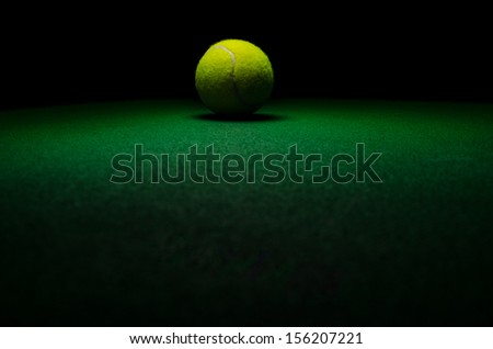 Tennis background - low key centered ball with green surface