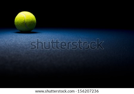 Tennis background - low key ball in corner with blue surface