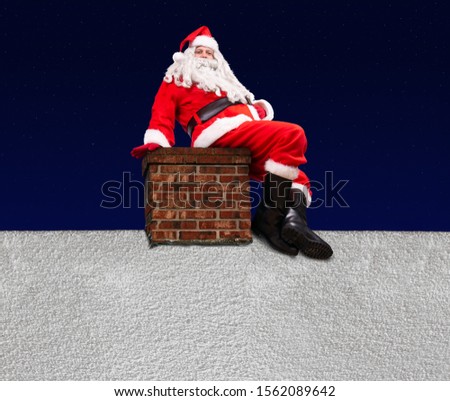 Santa Claus sitting on the chimney at a snowy roof of house, background of dark blue with stars.