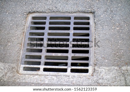 
sewer on road type metal grill