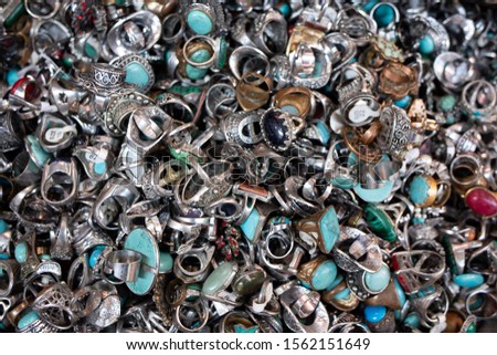 close-up of silver rings with colored, mineral gemstones, souvenir shop on the streets of the Old City of Jerusalem