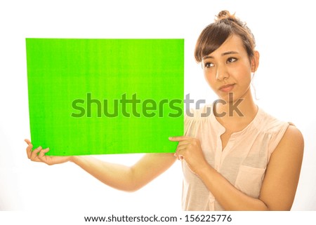 Asian caucasian mixed woman in white background holding green screen chroma key card board message