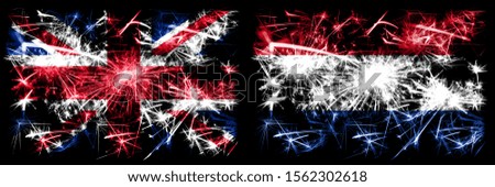 Great Britain, United Kingdom vs Netherlands, Dutch New Year celebration travel sparkling fireworks flags concept background. Combination of two abstract states flags.
