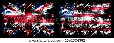 Great Britain, United Kingdom vs Liberia, Liberian New Year celebration travel sparkling fireworks flags concept background. Combination of two abstract states flags.
