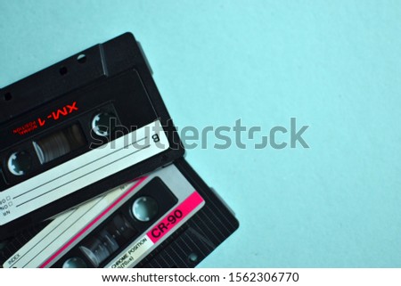 Audio cassette. Old rarity. Music on an old medium. Nostalgia, digitizing cassettes. For an 00s party. Royalty-Free Stock Photo #1562306770