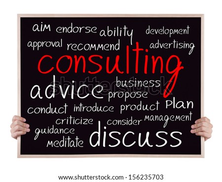 consulting and other related words handwritten on blackboard with hands