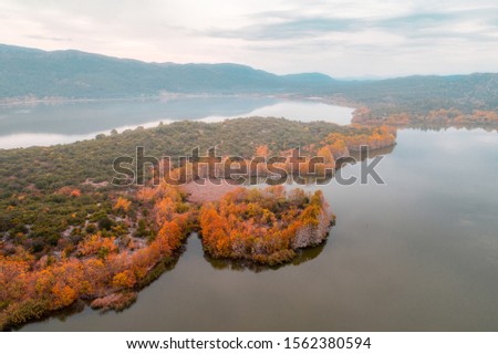 Kovada Lake in Autumn in foggy weather aerial photo shoot with drone
