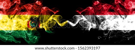Bolivia, Bolivian vs Yemen, Yemeni smoky mystic states flags placed side by side. Concept and idea thick colored silky abstract smoke flags