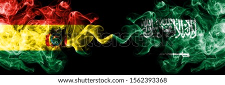 Bolivia, Bolivian vs Saudi Arabia, Arabian smoky mystic states flags placed side by side. Concept and idea thick colored silky abstract smoke flags