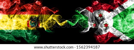 Bolivia, Bolivian vs Burundi, Burundian smoky mystic states flags placed side by side. Concept and idea thick colored silky abstract smoke flags