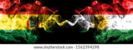 Bolivia, Bolivian vs Kurdistan, Kurdish smoky mystic states flags placed side by side. Concept and idea thick colored silky abstract smoke flags