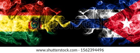 Bolivia, Bolivian vs Cuba, Cuban smoky mystic states flags placed side by side. Concept and idea thick colored silky abstract smoke flags
