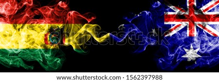 Bolivia, Bolivian vs Australia, Australian smoky mystic states flags placed side by side. Concept and idea thick colored silky abstract smoke flags
