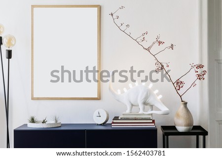 Stylish scandinavian living room with mock up photo frame, navy blue commode, table lamp and elegant accessories. Modern home decor. Interior design. Template Ready to use. 
